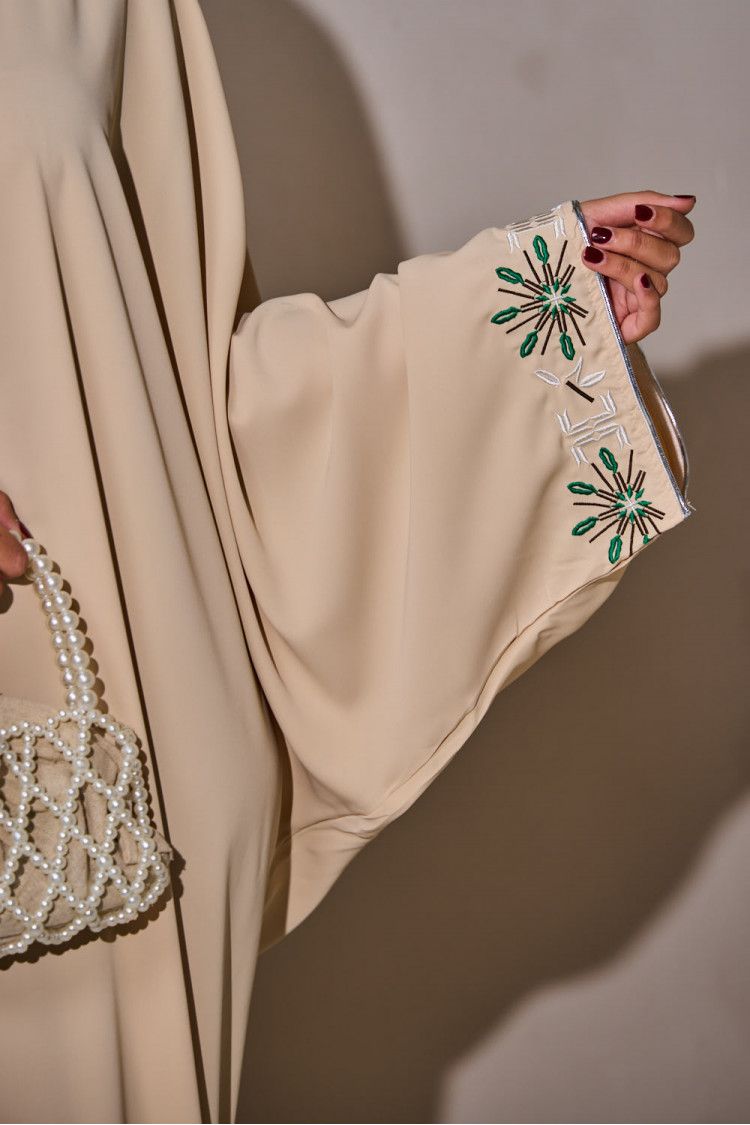 Beige abaya with geometric pattern on the collar