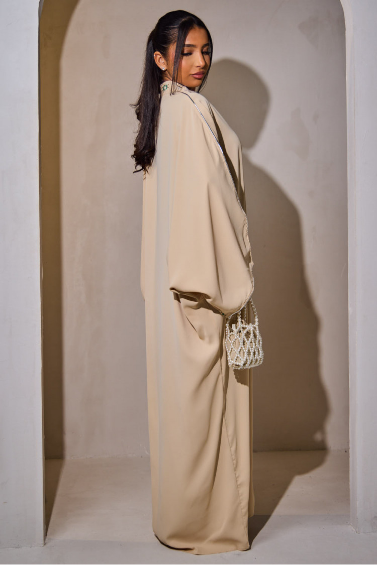 Beige abaya with geometric pattern on the collar