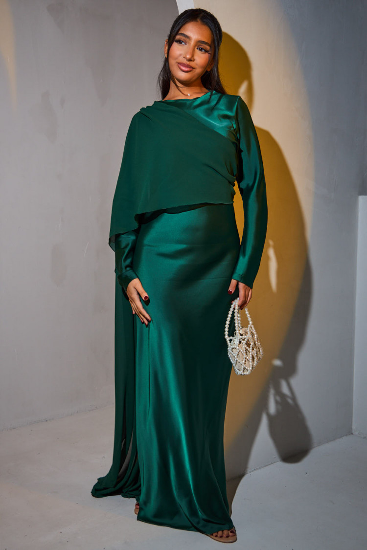 Green satin dress draped on the top