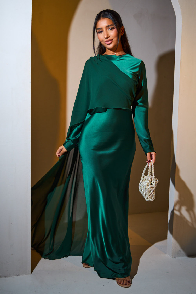 Green satin dress draped on the top